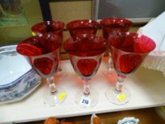 Set of six red glass cocktail vases with plain bases