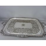 A LARGE RECTANGULAR TWIN HANDLED SERVING TRAY by Elkington & Co having a mask and shell rope twist