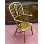 A WELL COLOURED WINDSOR ELBOW CHAIR, elm seated and yew backed spindle and splat chair with