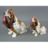 TWO ROYAL DOULTON SEATED SPANIELS with pheasants in their mouths, HN1028 and HN1029, 13 and 9 cms