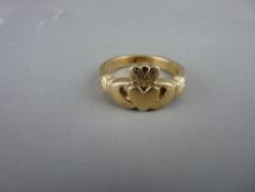 AN UNMARKED GOLD LOVE RING, 8.2 grms
