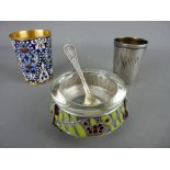 TWO RUSSIAN VODKA SHOT CUPS and a three footed white metal salt with champleve decoration and spoon,