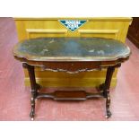 A VICTORIAN SHAPED TOP AND CARVED MAHOGANY SINGLE DRAWER WRITING TABLE with shelf cross rail on