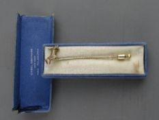 A PRESUMED GOLD SCOTTIE DOG STICK PIN in Gimbel Brothers, New York box (formerly set with presumed