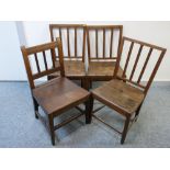 A MATCHING SET OF THREE, PLUS ONE OTHER, ANTIQUE OAK FARMHOUSE CHAIRS