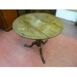AN ANTIQUE OAK TRIPOD TABLE with 74.5 cms diameter circular top, 68 cms high