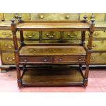 A REGENCY MAHOGANY THREE TIER DUMB WAITER with twin central drawers and carved reeded detail and