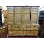 A SUBSTANTIAL EARLY 19th CENTURY OAK HOUSEKEEPER'S CUPBOARD having four top cupboard doors,