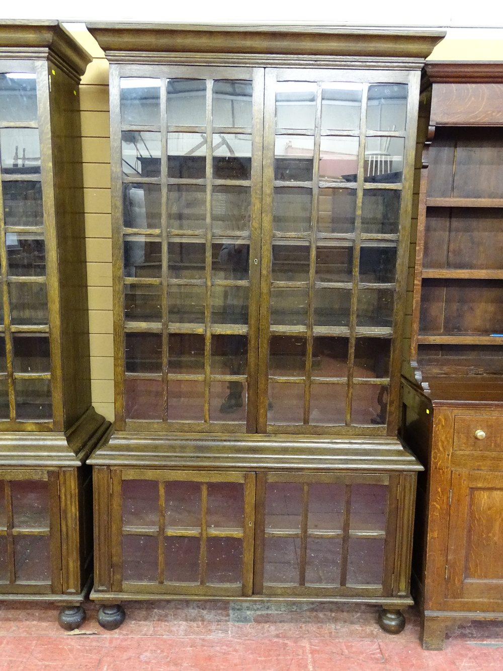 A GOOD SET OF FOUR 20th CENTURY OAK DOUBLE BOOKCASES having multi-panelled twin upper and lower - Image 2 of 6