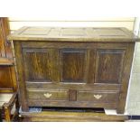 A GOOD REPRODUCTION OAK MULE CHEST with panel lidded top and front over twin lower drawers, on stile