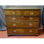 A GEORGIAN OAK CHEST OF TWO SHORT OVER THREE LONG DRAWERS with pierced brass backplates and swing