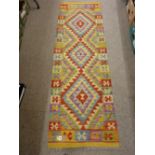 A VEGETABLE DYE WOOL SHOBI KILIM CARPET RUNNER, bright multi-coloured with triple diamond centre and