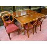 A WELL POLISHED VICTORIAN MAHOGANY PULL-OUT DINING TABLE with additional leaf and four balloon