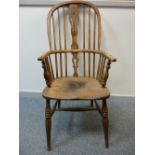 A 19th CENTURY STICKBACK WINDSOR ARMCHAIR, 110 cms high, 53 cms wide, 38 cms seat depth