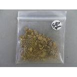 CLOGAU GOLD a parcel of small flakes and dust, 5.8 grms
