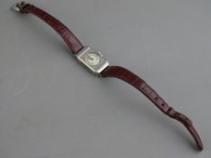 1930's VINTAGE LADY'S ROLEX RECTANGULAR STAINLESS STEEL WRISTWATCH on Petite leather strap, the case