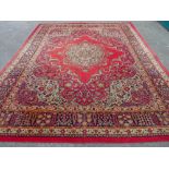 A WOODWARD GROSVENOR WILTON WOVEN CARPET, red ground with extensive floral pattern and multiple
