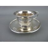 A SILVER CUP & SAUCER, Birmingham 1932, 2.1 troy ozs, 5 cms high combined (monogrammed O F S, cup