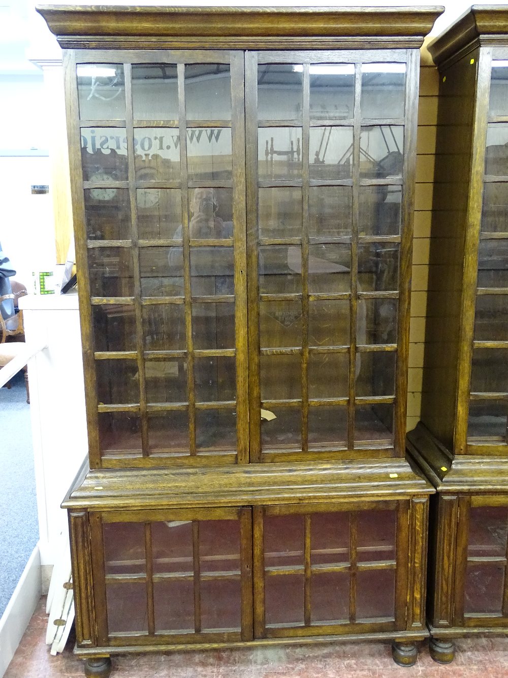 A GOOD SET OF FOUR 20th CENTURY OAK DOUBLE BOOKCASES having multi-panelled twin upper and lower - Image 5 of 6