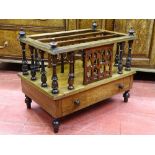 A VICTORIAN WALNUT THREE SECTION CANTERBURY having a single base drawer with inlay detail, spindle