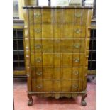 A GOOD REPRODUCTION WALNUT SIX DRAWER CHEST with shaped top and drawers, pierced brasswork, on