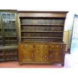 A 19th CENTURY OAK NORTH WALES DRESSER with three shelf rack over a 'T' arrangement of six pine