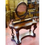 A VICTORIAN MAHOGANY DUCHESS DRESSING TABLE having an oval mirror on carved support above a bank