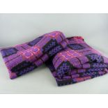 AN EXCELLENT PAIR OF VINTAGE WELSH WOOLLEN BLANKETS, traditional patterns in purple and pink tones