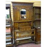 AN EXCELLENT JACOBEAN STYLE OAK MIRRORED HALLSTAND with carved and pierced rail detail, single