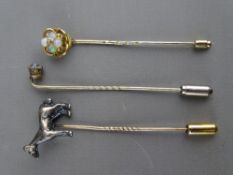THREE VINTAGE STICK PINS including a silver/white metal horse with diamond eye, a possibly gold knot
