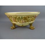 A ROYAL WORCESTER BLUSH IVORY & GILT DECORATED THREE FOOTED BOWL, 8.5 cms high, 17.5 cms diameter