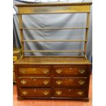 AN ANTIQUE CONVERTED MULE CHEST/DRESSER, the base having six opening drawers with pierced brass