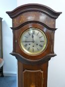 A CIRCA 1900 INLAID MAHOGANY CHIMING GRANDMOTHER CLOCK, the silvered dial set with Roman numerals,