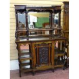 A LATE 19th CENTURY ROSEWOOD & EBONIZED MIRRORED BACK SIDE CABINET having spindle galleries,