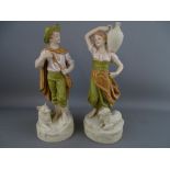 A PAIR OF ROYAL DUX ORNAMENTAL FIGURINES of a young man and his dog and a vessel carrying maiden