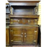 A WELL COLOURED OAK TRIDARN of peg-joined construction with brass butterfly hinges, the canopied top