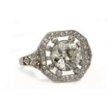 An Art-Déco diamond ring circa 1940. 18 ct. white gold with a 2,45 ct. brilliant cut diamond as cen