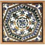 A 16th century wallplaque with four Catalan showing tiles