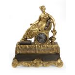 A 19th century French Empire period mantel clock in ormolu bronze with an Odalisque