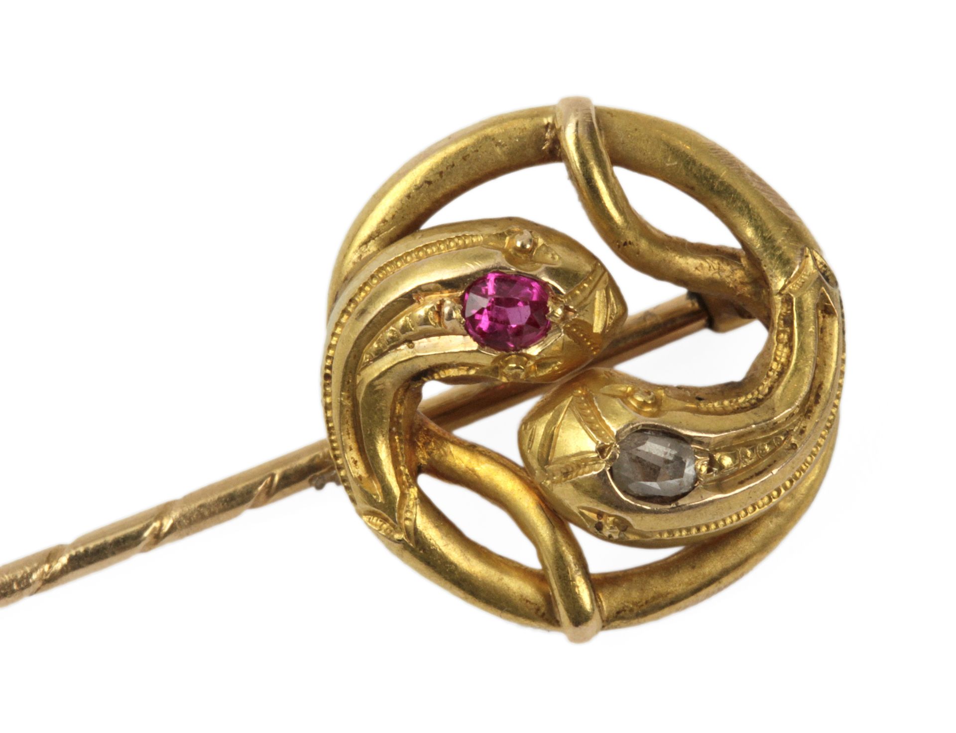 A brilliant cut diamonds and synthetic rubis serpent shaped pin