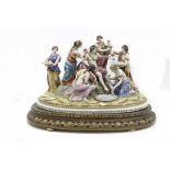 A 20th century group of figurines in Capodimonte porcelain depicting Apollo's Bath