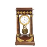 A 19th century French mahogany Portico mantel clock