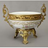 A 19th century French centrepiece in Sévres porcelain with a gilt bronze mount