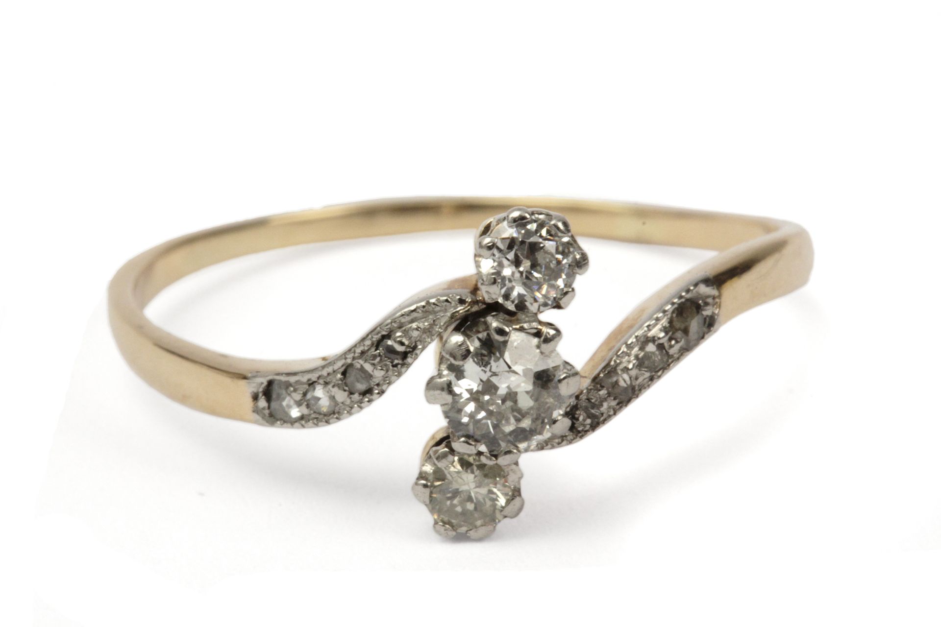 A navette shaped ring. 18 ct. yellow gold, platinum and brilliant cut diamonds