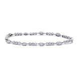 A tennis bracelet. Platinum setting with brilliant cut and marquise cut diamonds