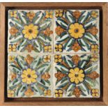 An 18th century wallplaque with four Catalan showing tiles
