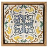 A 17th century wallplaque with four Catalan showing tiles