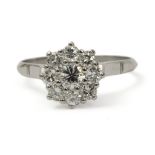 A platinum and brilliant cut diamonds cluster ring