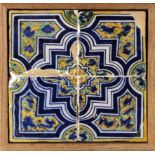 A 17th century wallplaque with four Catalan showing tiles