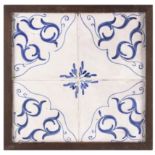 A 19th century wallplaque with four Catalan showing tiles